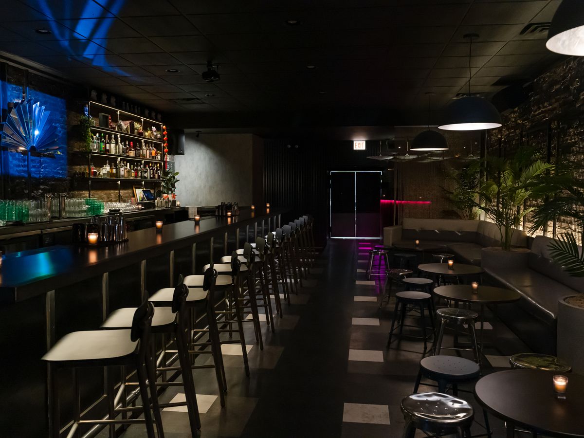 A dark bar with blue lighting.