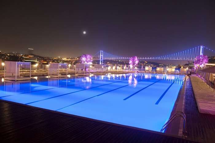 A view of the pool with the Bosphorous Bridge in the background
