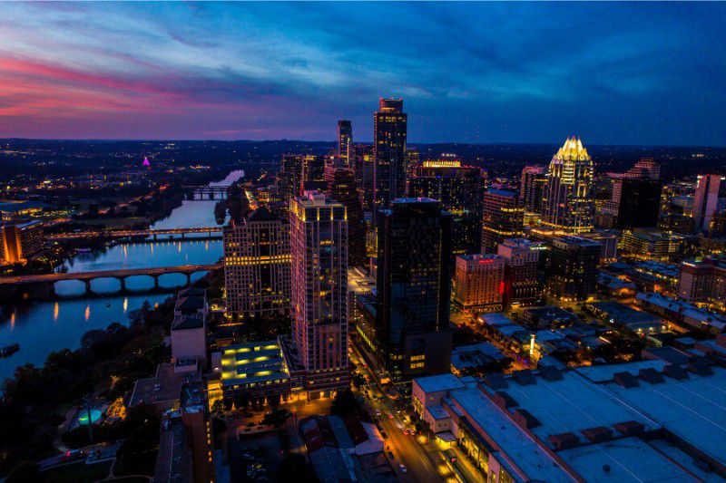 Austin TX city buildings at twilight with colorful sky
