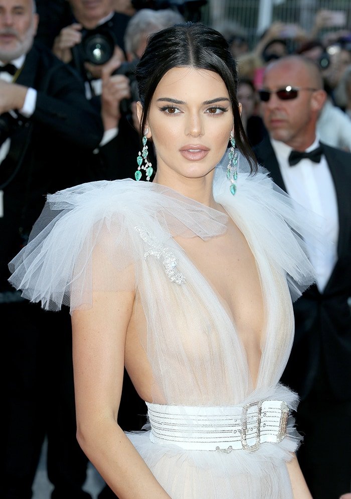 Kendall Jenner provides a glimpse of her breasts in a sheer Schiaparelli Haute Couture gown at the 71st Annual Cannes Film Festival on May 12, 2018