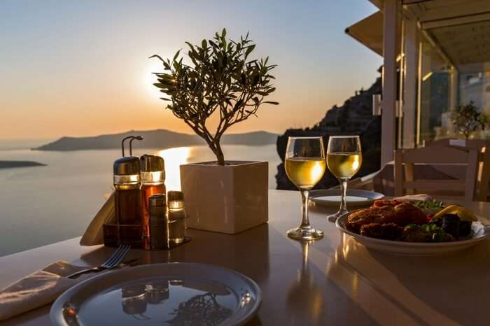 Romantic dining setup by the sea in Santorini in Greece