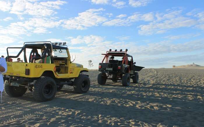Safari jeeps parked in the dunes of Paoay in Ilocos Norte