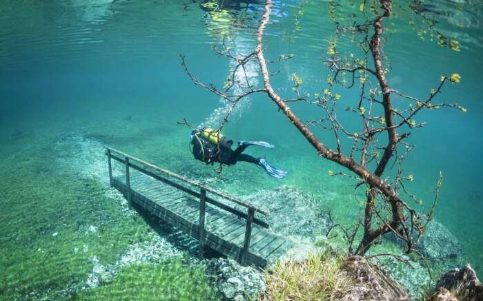 Scuba divers can explore the green grass and benches of this underwater park at Green Lake in Austria.