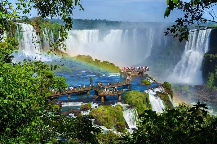 Tourists gather at the top of the Iguazu Falls at the border of Argentina and Brazil