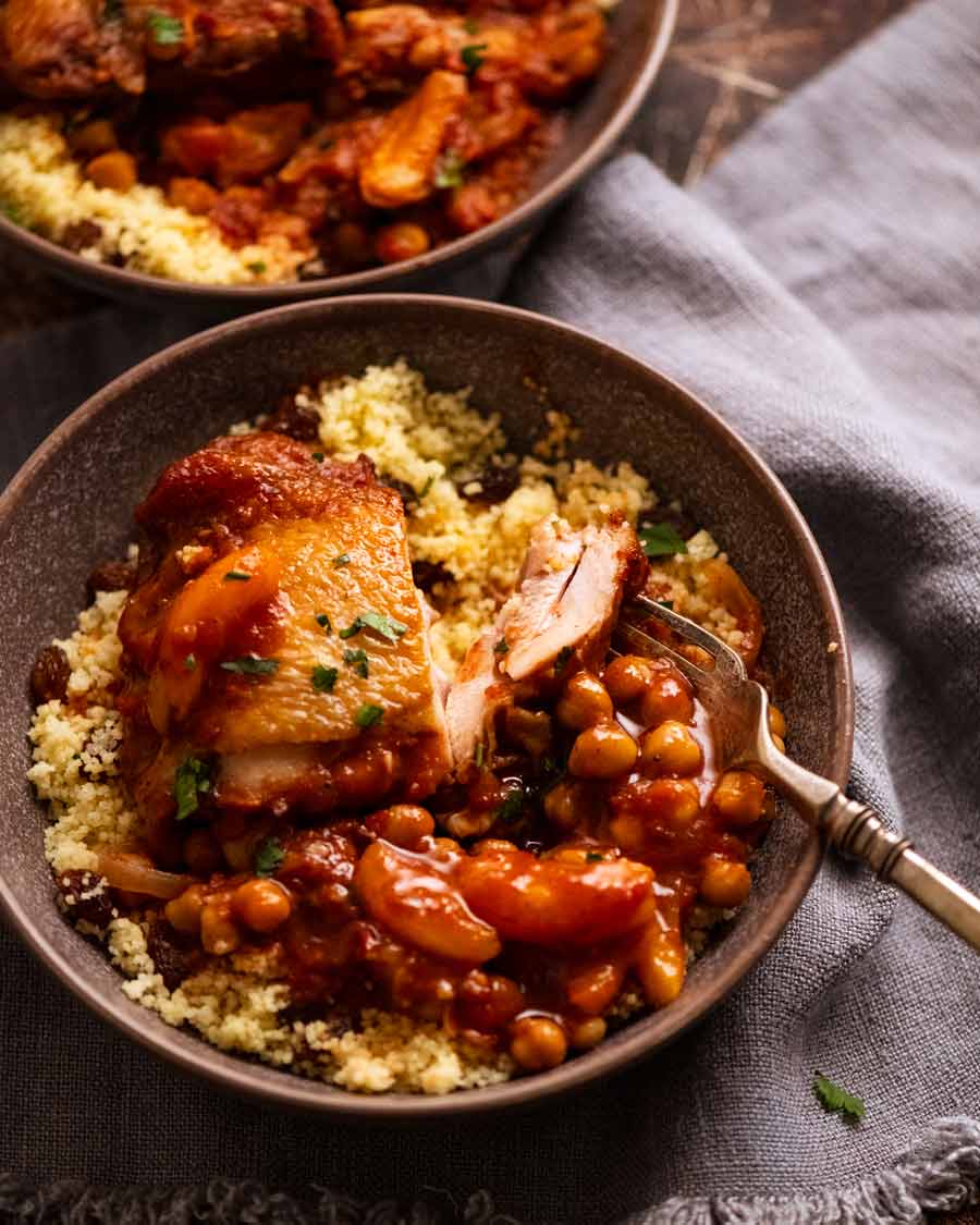 Moroccan Chicken Tagine served in a bowl on a bed of couscous